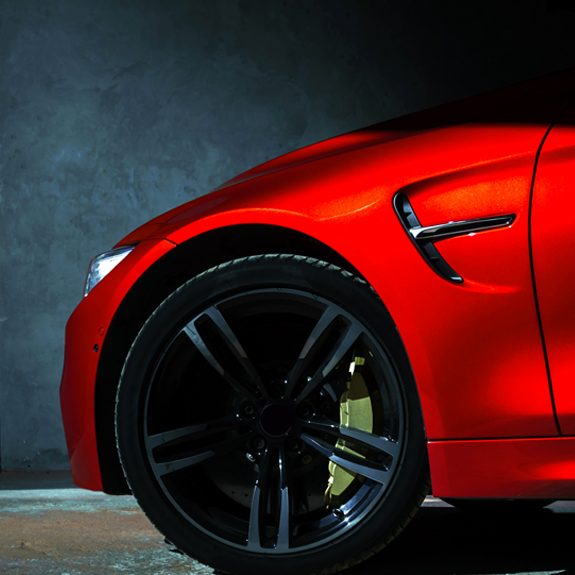 Clean shiny red car and wheel